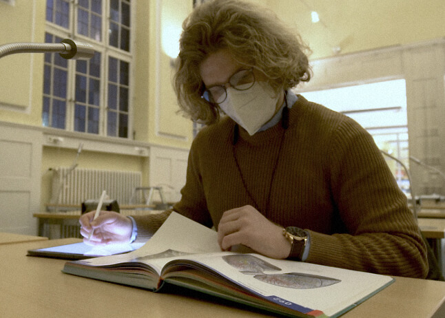 Taher studying at a desk